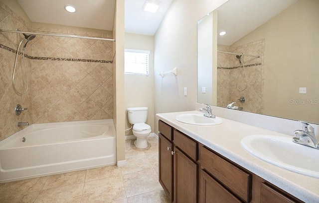 full bath featuring tub / shower combination, a sink, toilet, and double vanity