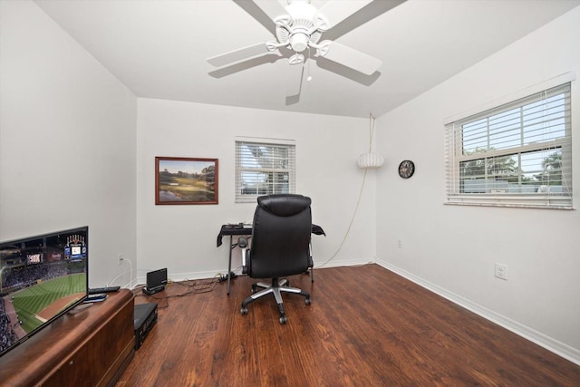 office space with plenty of natural light, baseboards, ceiling fan, and wood finished floors