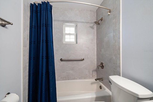 bathroom with shower / bath combination with curtain and toilet