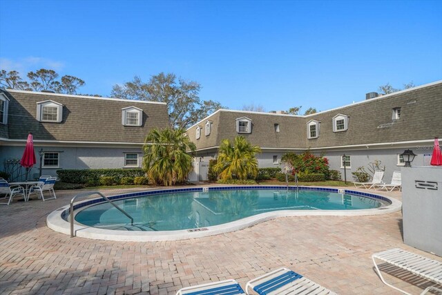 community pool featuring a patio