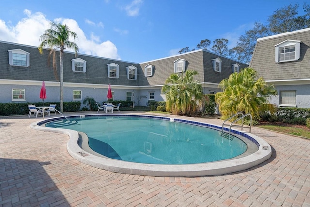 pool with a patio area