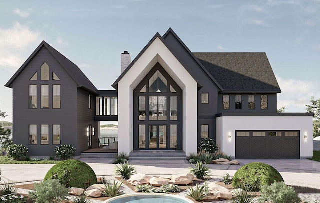 view of front of home featuring driveway, a chimney, and stucco siding