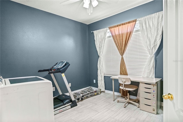 office featuring ceiling fan and baseboards