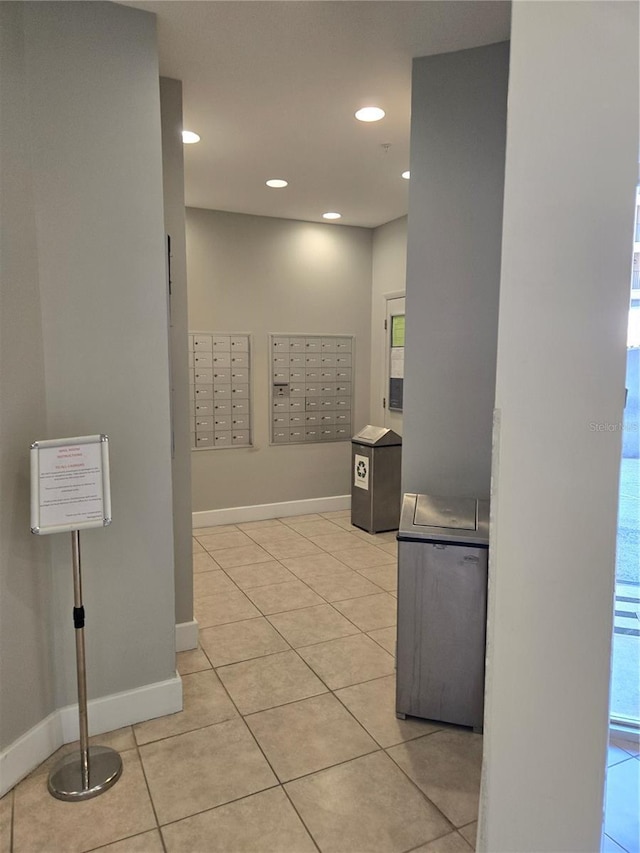 bathroom with recessed lighting, tile patterned flooring, mail area, and baseboards