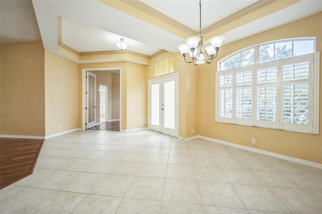 spare room with french doors, a notable chandelier, a raised ceiling, baseboards, and tile patterned floors