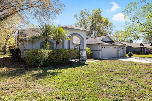 view of front of home featuring a garage, a front lawn, concrete driveway, and stucco siding