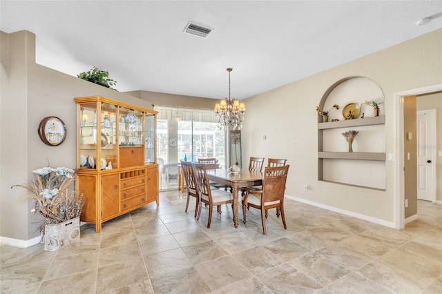 dining room featuring baseboards, built in shelves, visible vents, and an inviting chandelier