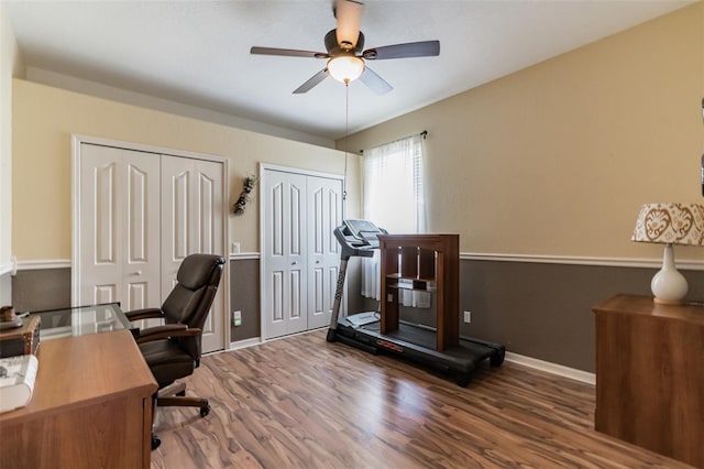 office featuring ceiling fan, baseboards, and wood finished floors