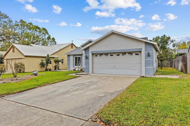 ranch-style home featuring an attached garage, fence, driveway, stucco siding, and a front yard