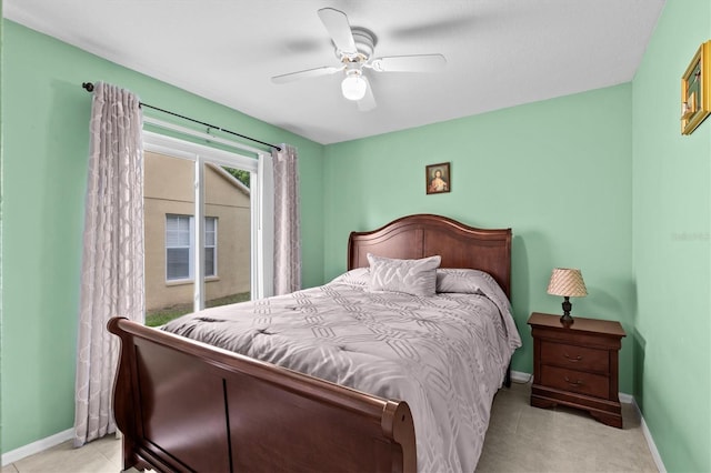 bedroom featuring tile patterned floors, a ceiling fan, and baseboards
