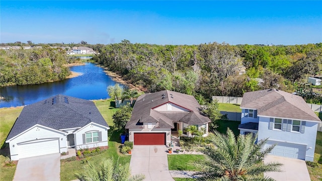 birds eye view of property featuring a water view