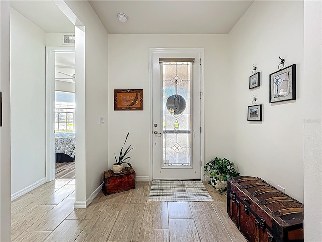 entryway with visible vents, baseboards, and light wood-style floors