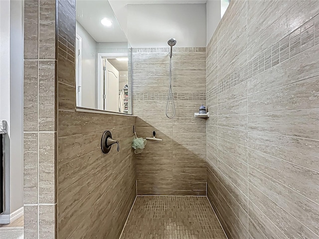 bathroom with tiled shower