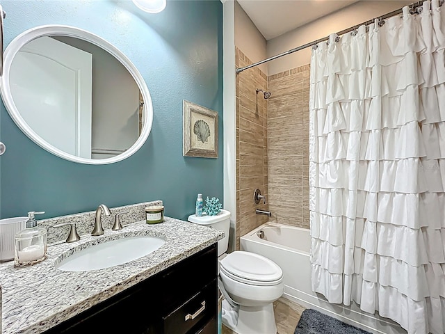 full bath with vanity, wood finished floors, toilet, and shower / bathtub combination with curtain