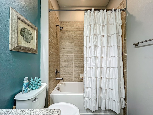 full bathroom featuring toilet, a textured wall, and shower / bathtub combination with curtain