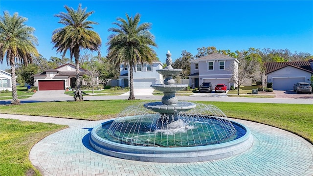 view of property's community with a yard and a residential view