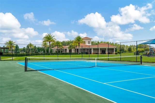 view of tennis court with fence