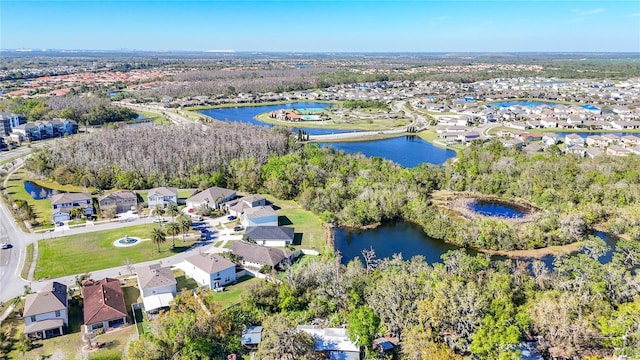 bird's eye view featuring a water view and a residential view