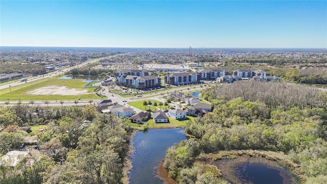 birds eye view of property featuring a water view and a residential view