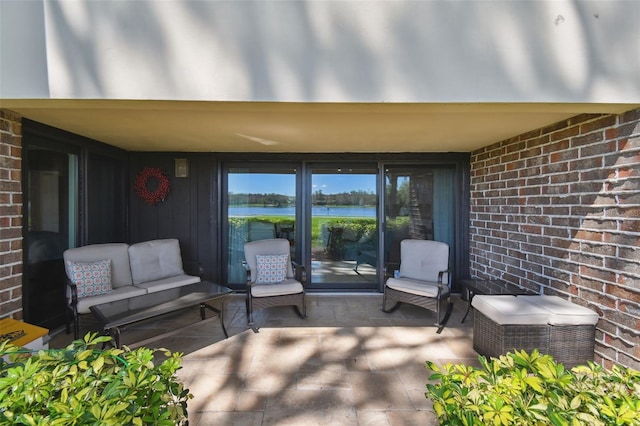 view of patio featuring a water view and an outdoor hangout area