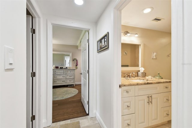 bathroom with recessed lighting, visible vents, vanity, and baseboards