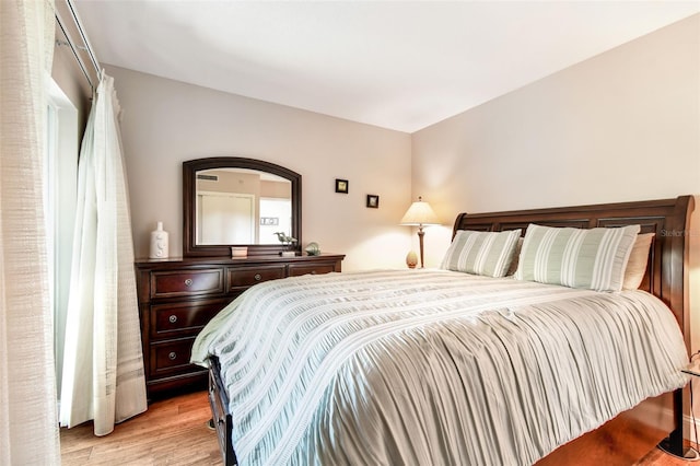 bedroom with light wood finished floors