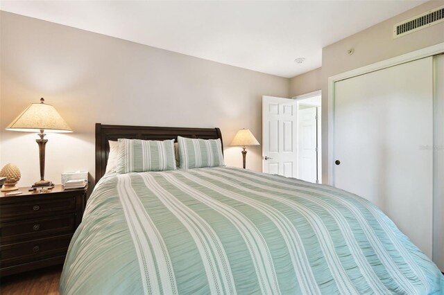 bedroom with a closet and visible vents