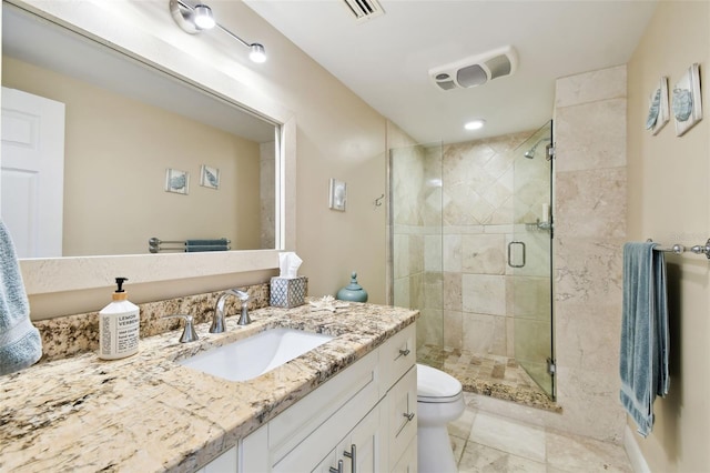 full bathroom featuring visible vents, a stall shower, vanity, and toilet