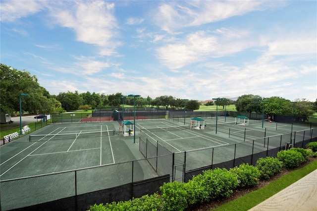 view of sport court featuring fence