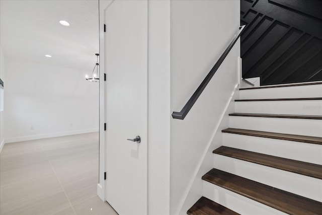 stairs with tile patterned floors, recessed lighting, and baseboards