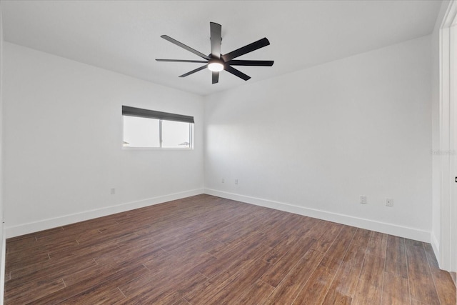 spare room with a ceiling fan, baseboards, and wood finished floors