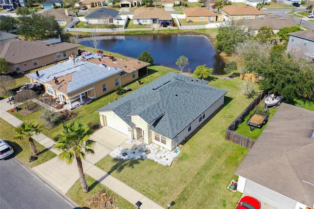 aerial view with a residential view and a water view