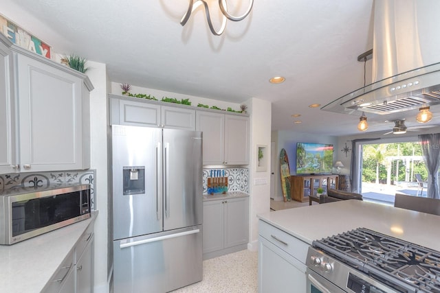 kitchen featuring light speckled floor, stainless steel appliances, recessed lighting, tasteful backsplash, and light countertops