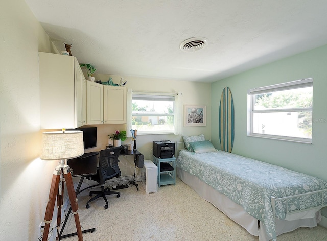 bedroom featuring visible vents