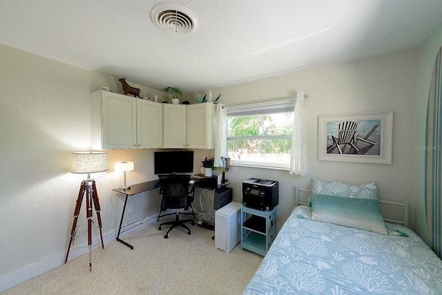 bedroom with visible vents and baseboards