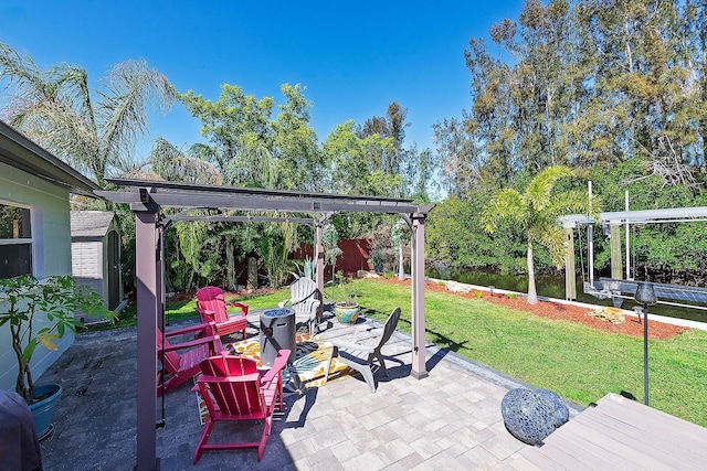 view of patio / terrace featuring an outdoor fire pit, an outdoor structure, fence, a pergola, and a shed