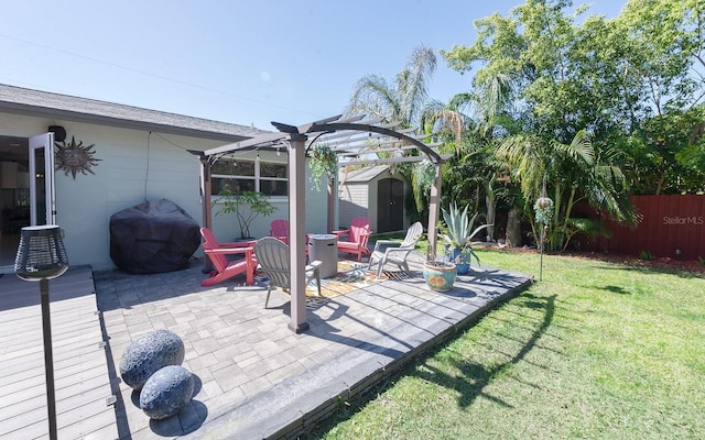 exterior space with a storage shed, area for grilling, a fenced backyard, an outdoor structure, and a pergola