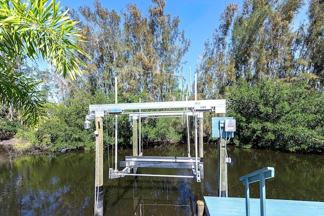 view of dock with a water view and boat lift