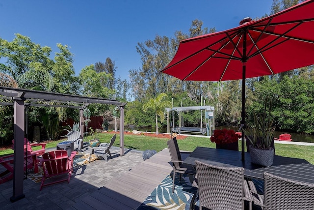 wooden terrace featuring a lawn, a fire pit, a pergola, and outdoor dining space