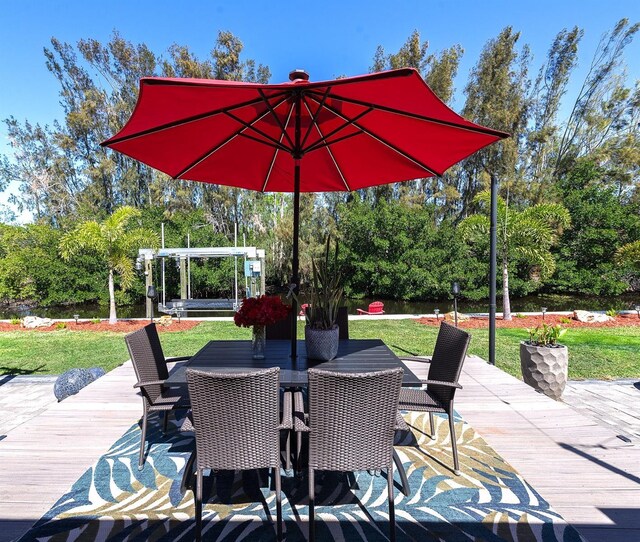 view of patio with outdoor dining area and a wooden deck