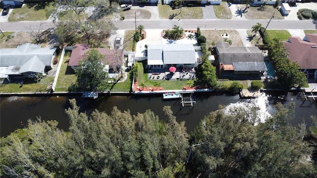 birds eye view of property featuring a water view and a residential view