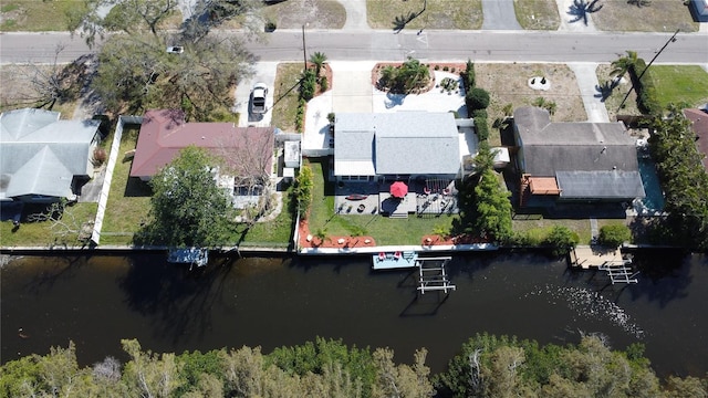 bird's eye view featuring a water view and a residential view