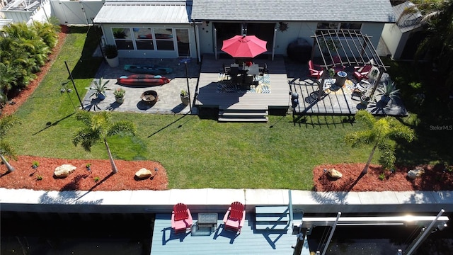 exterior space featuring a yard and a wooden deck