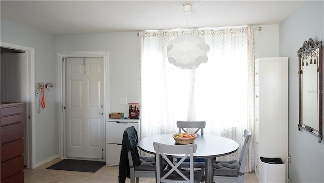 dining room featuring a wealth of natural light and light tile patterned floors