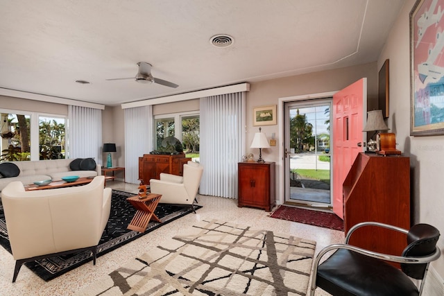 2340 W Bay Isle Dr SE, Saint Petersburg, FL 33705 - sitting room with a ceiling fan, a wealth of natural light, visible vents, and speckled floor