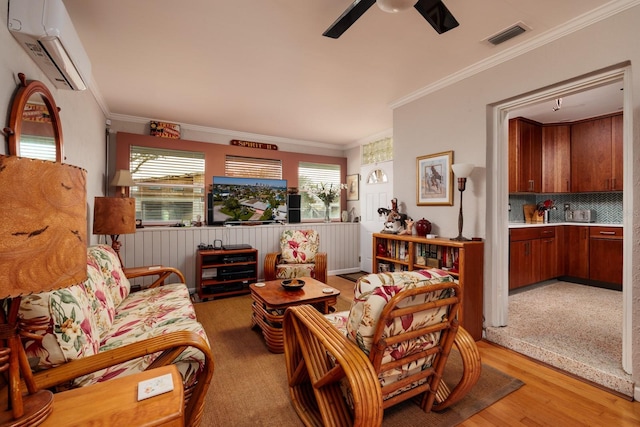 2340 W Bay Isle Dr SE, Saint Petersburg, FL 33705 - living area featuring light wood-style floors, visible vents, ornamental molding, and a wall mounted air conditioner
