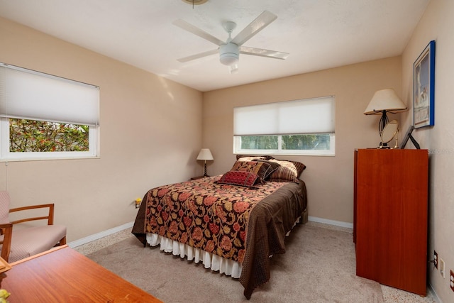 2340 W Bay Isle Dr SE, Saint Petersburg, FL 33705 - carpeted bedroom with baseboards and a ceiling fan