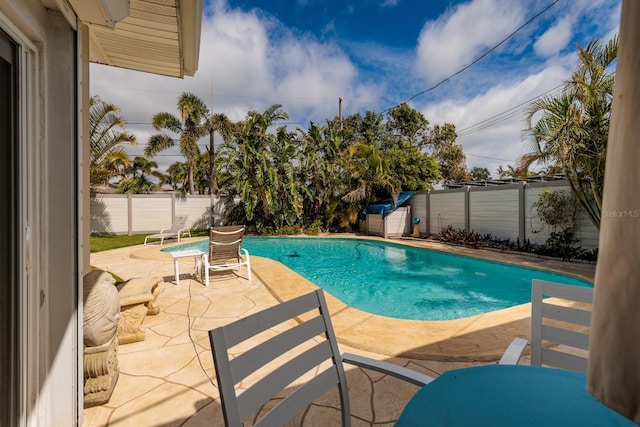 2340 W Bay Isle Dr SE, Saint Petersburg, FL 33705 - view of pool featuring a patio area, a fenced backyard, and a fenced in pool