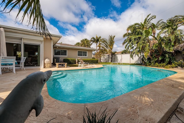 2340 W Bay Isle Dr SE, Saint Petersburg, FL 33705 - view of swimming pool with a patio area, fence, and a fenced in pool