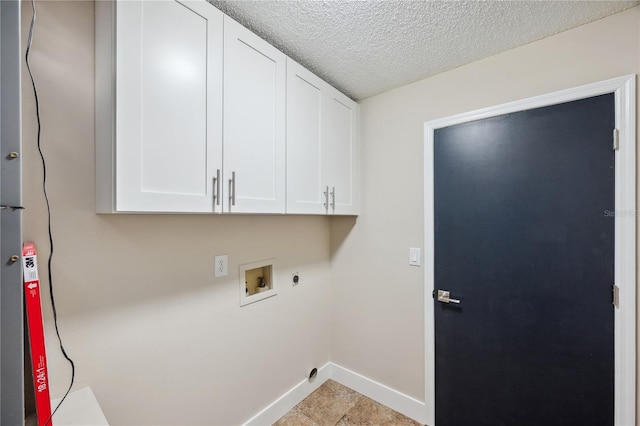 washroom with cabinet space, baseboards, hookup for a washing machine, a textured ceiling, and electric dryer hookup